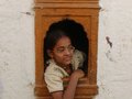 India: Girl in Window - human-rights photo