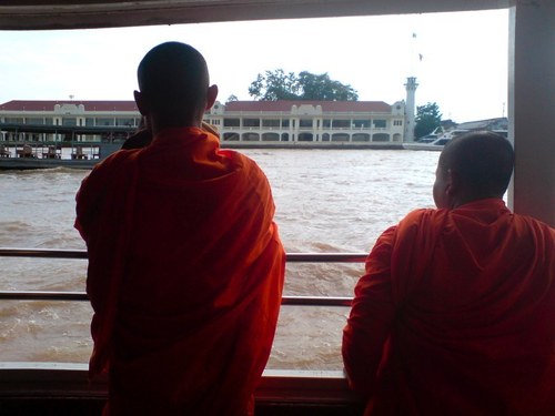 Monks on river boat