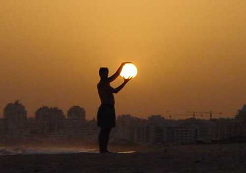 Man "holding" sun